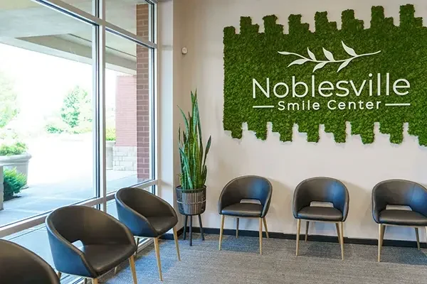 Waiting area chairs beneath the Noblesville Smile Center moss wall