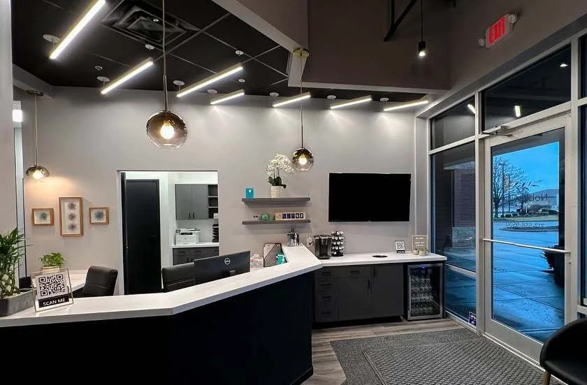 Patient lounge and refreshment area with TV and coffee station