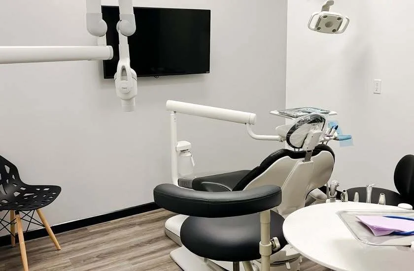 Modern dental operatory with wall-mounted TV for patient comfort