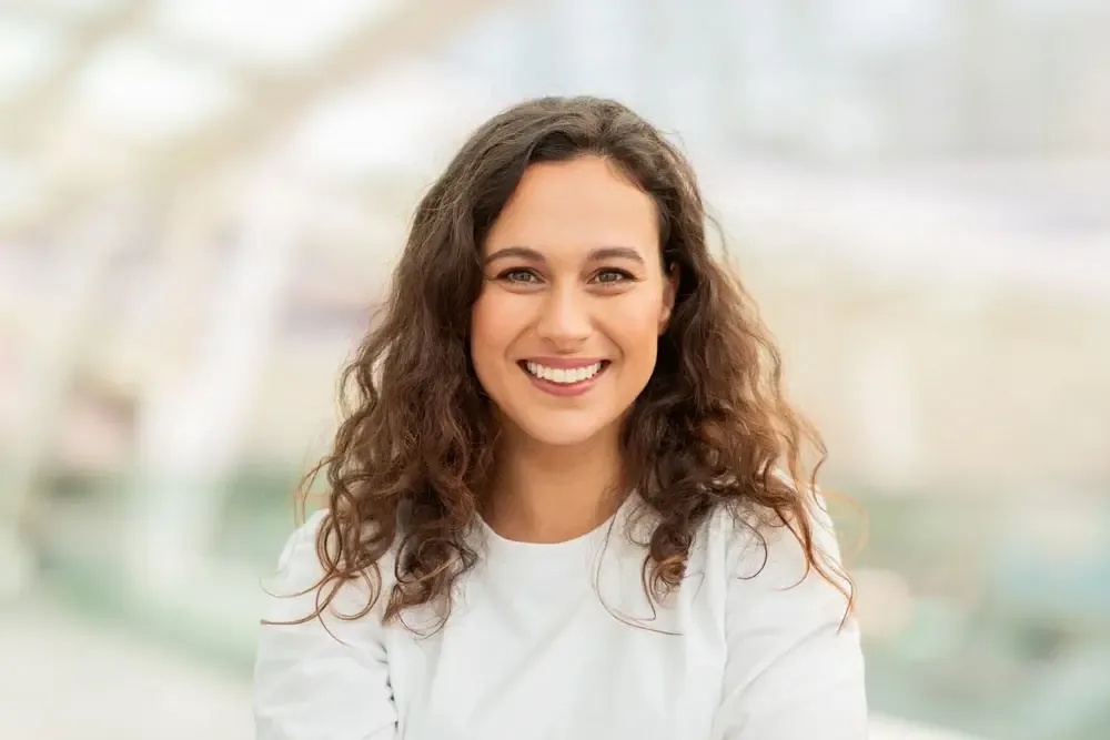 Patient smiling for dental implant benefits education