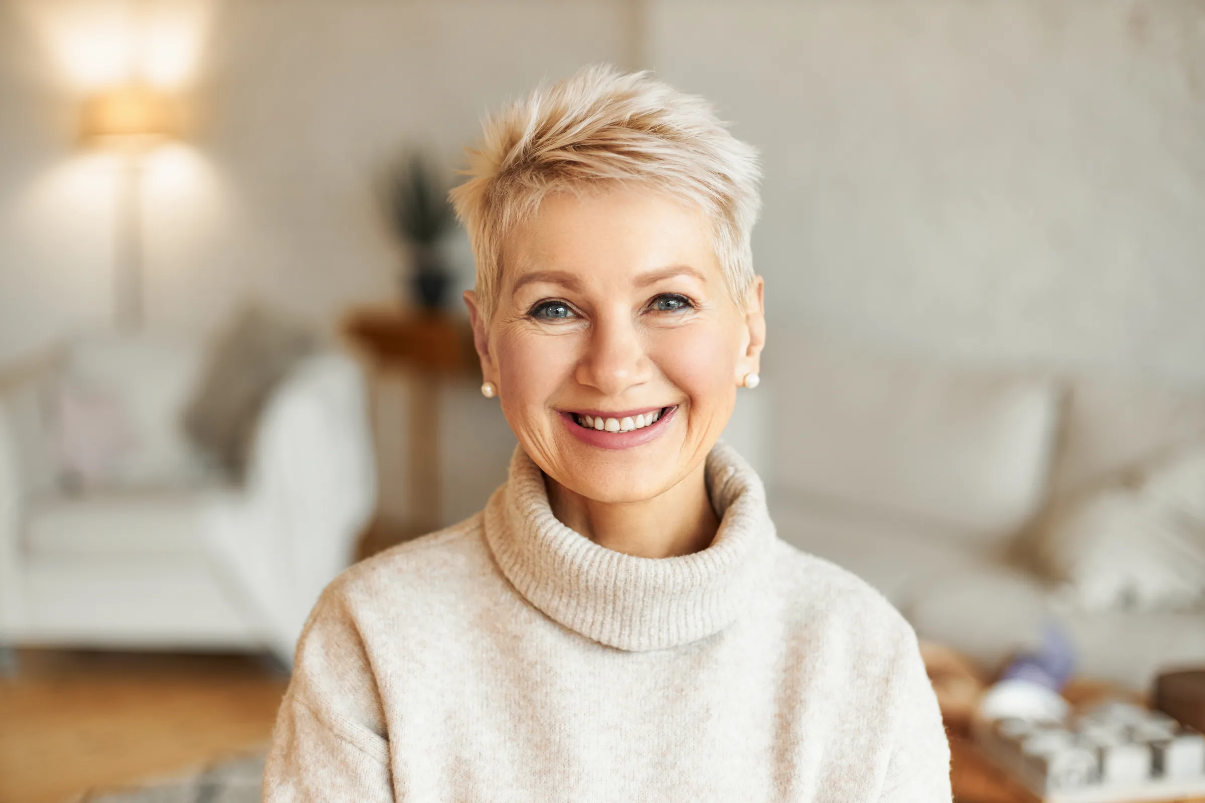 Patient smiling for gum disease symptoms education